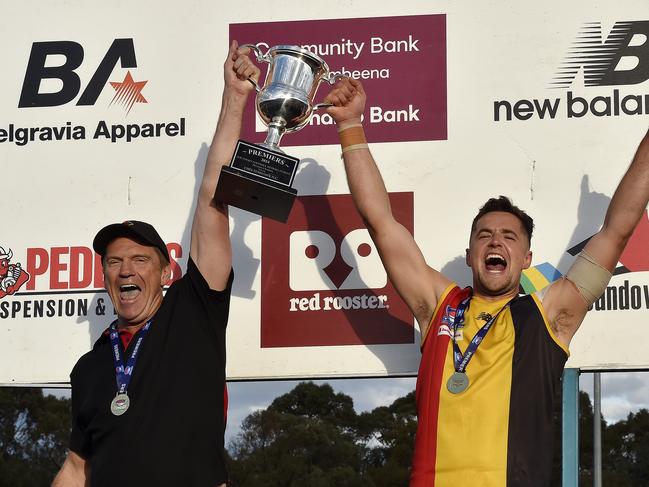 Cheltenham Seniors coach Justin Pickering (left) holds the trophy aloft after winning Southern League Division 1 with Cheltenham. Picture: Andrew Batsch.