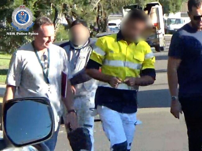 Police arrest two men (centre) in connection to the kidnapping. Photo NSW Police