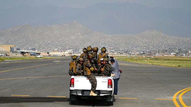 Members of the Taliban ‘special forces’ ride around Kabul Airport after the last US troops left Afghanistan. Picture: AFP