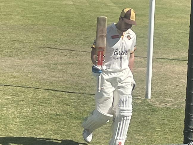 Heatherhill centurion Kristian Miller raises his bat. Pic: Tyler Lewis