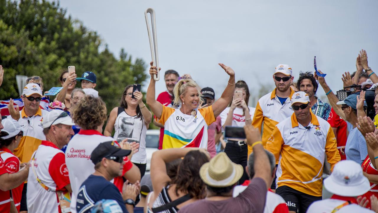 100: Baton Bearer Lisa Curry is greeted by huge crowds as she carries the Queen’s Baton on the last day of the relay ahead of the official start to the 2018 Gold Coast Commonwealth Games. Picture: Jerad Williams