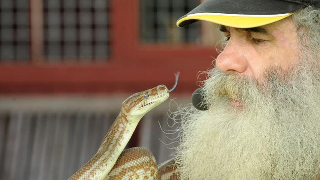 Bearded Dragon Hotel, Tamborine — Brian "Furry" McLean of Crocodiles and Dragons with Jacqueline the Python.