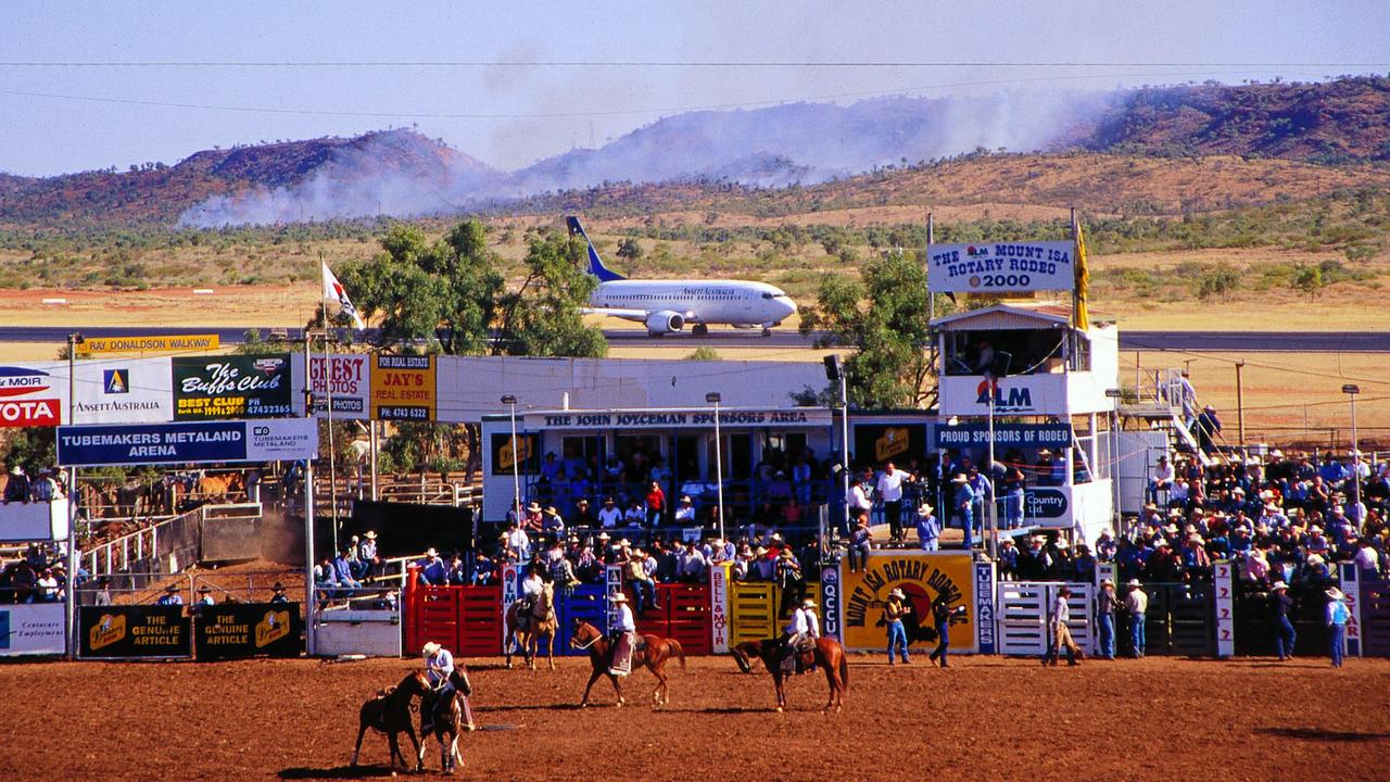 Looking down on the Mount Isa Rodeo arena at Kalkadoon Park, with a jet plane on runway behind Kalkadoon Park. Picture: John Elliott