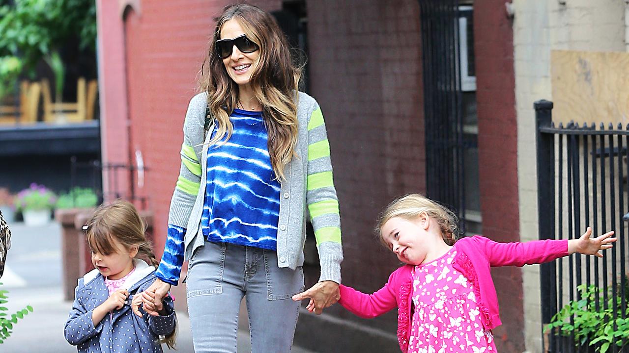 Parker walking her twin daughters Marion and Tabitha to school in NYC in 2014. Picture: Splash