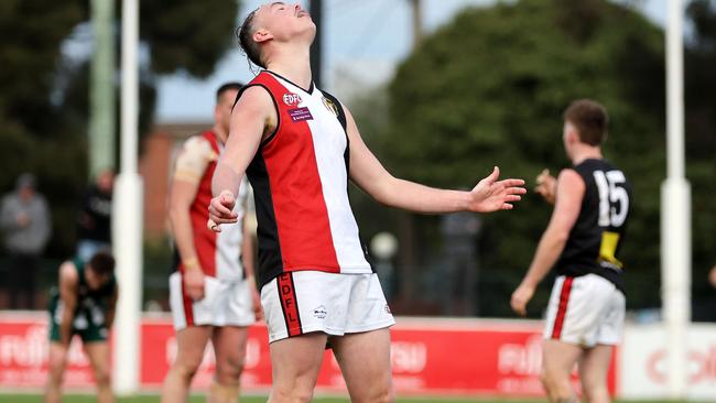 EDFL: West Coburg’s Liam Bowkett misses a shot for goal. Picture: George Salpigtidis