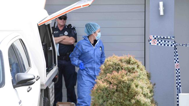 Forensic officers outside the Baringa home. Picture: Patrick Woods.