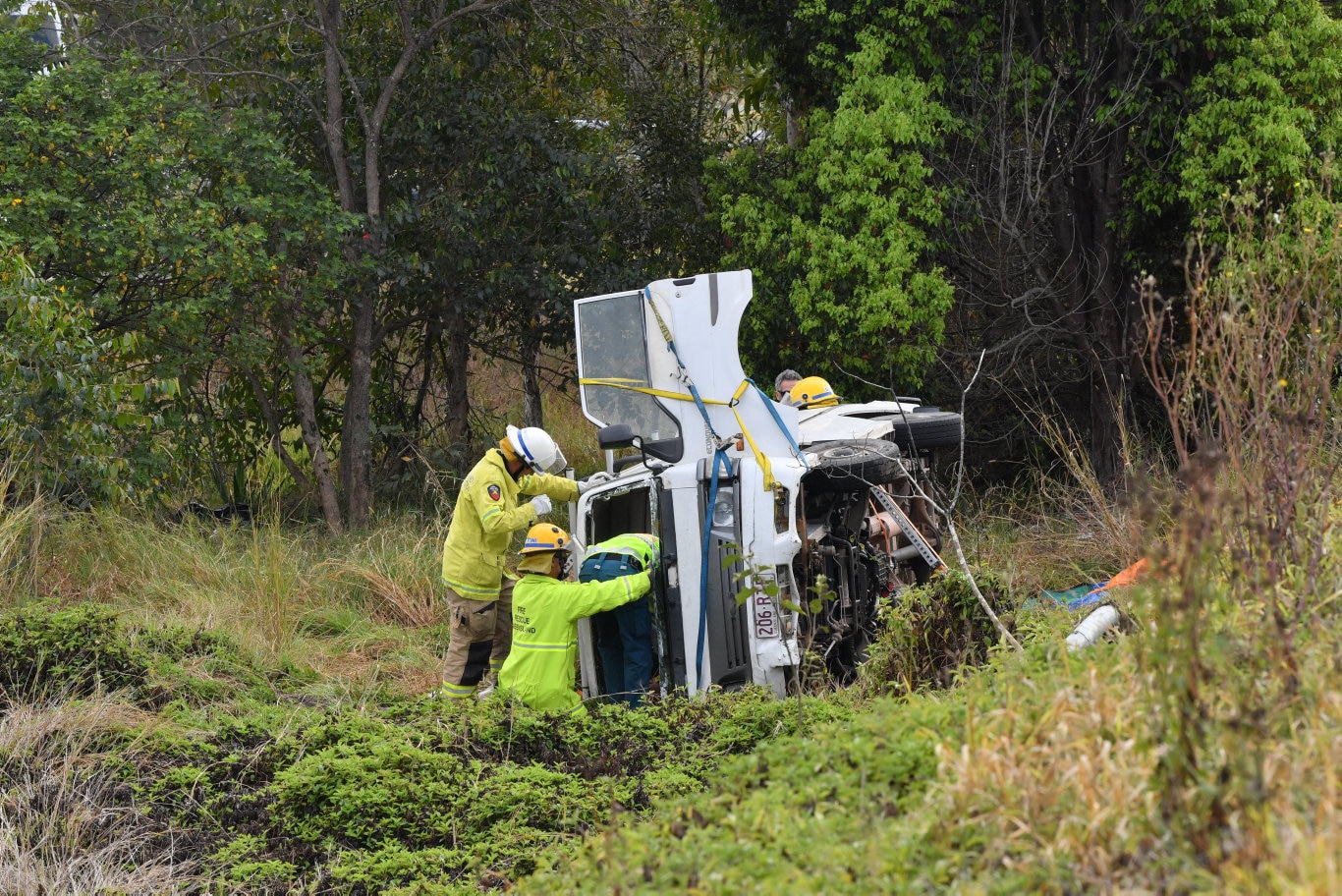 A 70 year old female was trapped inside their vehicle after it rolled on the Coolum-Yandina Road near the Coolum roundabout on the Sunshine Motorway. Photo: John McCutcheon / Sunshine Coast Daily