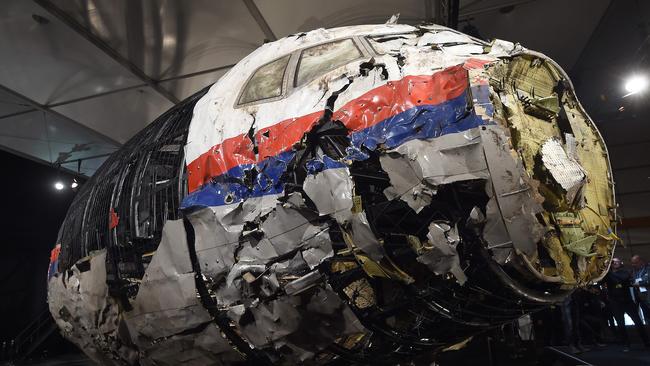 The wrecked cockipt of the Malaysia Airlines flight MH17 is presented to the press during a presentation of the final report on the cause of the its crash at the Gilze Rijen airbase.