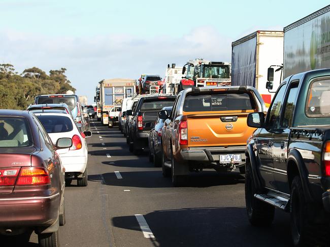 MELBOURNE, AUSTRALIA - NewsWire Photos JULY 13, 2020 : COVID-19 .Cars bank up before the Victorian Police and Australian Defence Force personnel inspecting cars at a vehicle checkpoint on the Princes Highway at Little River, near Geelong , Victoria. Picture : NCA NewsWire / Ian Currie