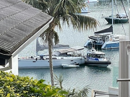 Water police preparing to remove the bodies from the yacht. Picture: Madeleine Damo