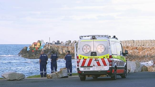 Authorities search for man washed off the southern breakwall at Coffs Harbour. Photo by Frank Redward