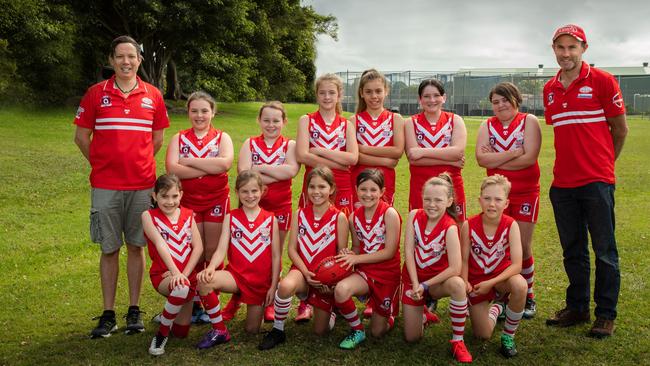 WONDER WOMEN: The coaches and the Lismore Swans Junior Australian football Club young women playing in the Girls U11.5 team.