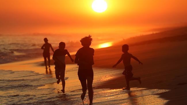 Children play in Lakes Entrance, weeks after the bushfire threat was lifted. Picture: Alex Coppel.