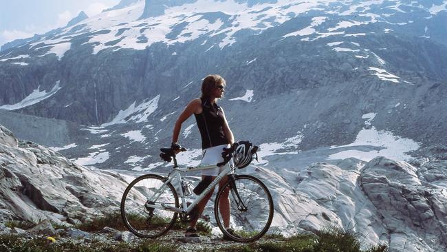 Danielle Stynes, owner of SwisSkiSafari, biking in the Swiss Alps