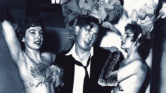 Tony Moynihan lets his hair down with a couple of showgirls in Sydney in 1956.