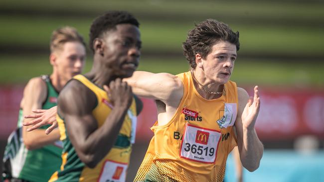 Epeosi Ugbomhe from Werrington passes Bronson Bzadough from Bankstown on his way to victory. Picture: Julian Andrews