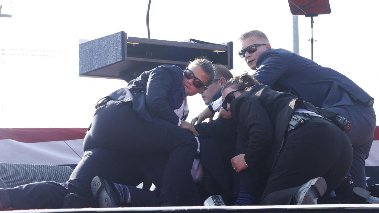 Secret Service agents rushed the former US president candidate offstage. Picture: Anna Moneymaker/Getty Images/AFP