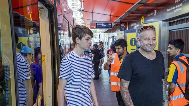 Passengers hoping on and off the light rail. Picture: Jerad Williams