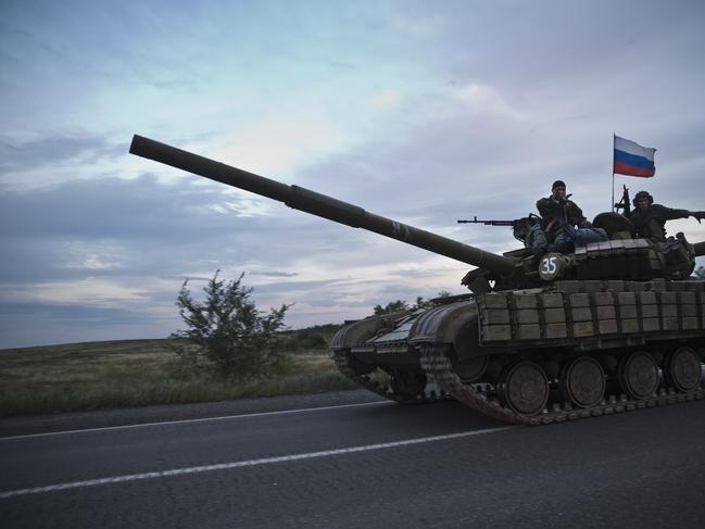 Tanks carrying Russian flags seen on the road from Donetsk to the Russian border days after the MH17 crash. Picture: Ella Pellegrini