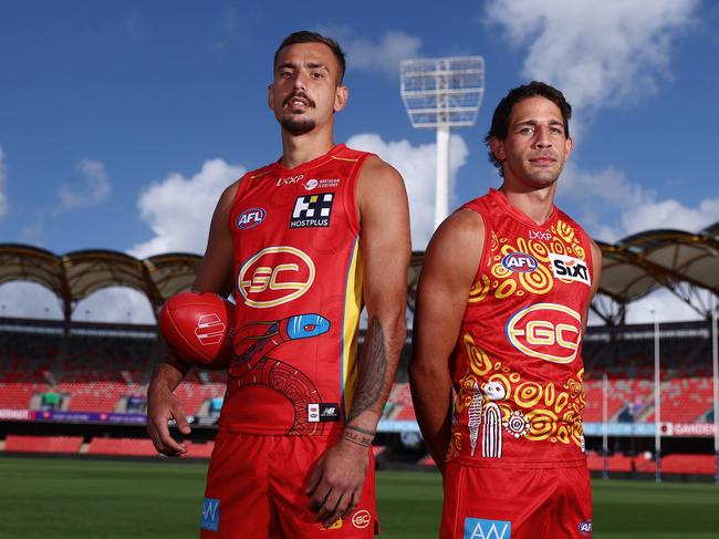 GOLD COAST, AUSTRALIA - APRIL 22: Joel Jeffrey and Ben Long pose during the Gold Coast Suns AFL Indigenous Guernsey Launch at People First Stadium on April 22, 2024 in Gold Coast, Australia. (Photo by Chris Hyde/Getty Images)