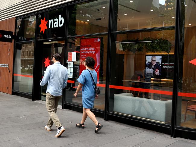 SYDNEY, AUSTRALIA - MARCH 27: Pedestrians walk past National Australia Bank Ltd. branch at Barangaroo on March 27, 2024 in Sydney, Australia. In the last quarter, Westpac Bank reported a quarterly cash profit of A$1.8 billion, meeting consensus expectations, while NAB experienced a 17% decline in first-quarter cash profit compared to the previous corresponding period, reflecting varying performances among the major Australian banks. (Photo by Brendon Thorne/Getty Images) (Photo by Brendon Thorne/Getty Images)