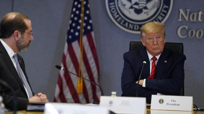 President Donald Trump listens during a teleconference with governors at the Federal Emergency Management Agency headquarters in Washington.