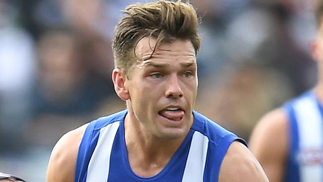 Shaun Higgins of the Kangaroos (centre) is seen in action during the Round 12 AFL match between the Geelong Cats and the North Melbourne Kangaroos at GMHBA Stadium in Geelong, Saturday, June 9, 2018. (AAP Image/Julian Smith) NO ARCHIVING, EDITORIAL USE ONLY