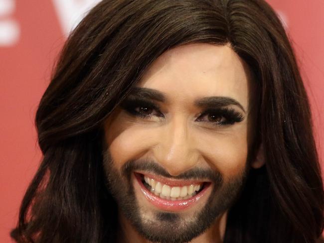 Austrian singer Conchita Wurst attends a press conference in Vienna, Austria Sunday May 11, 2014. Bearded drag queen Conchita Wurst has made a triumphant return to Austria after winning the Eurovision Song Contest in Copenhagen Saturday, in what the country's president called a victory for tolerance in Europe. (AP Photo/Ronald Zak)