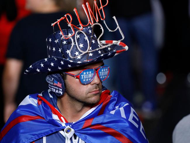 A man attends a former US President Donald Trump's Save America rally at Macomb County Community College Sports and Expo Center in Warren, Michigan, on October 1, 2022. (Photo by JEFF KOWALSKY / AFP)