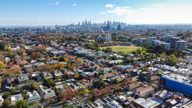 Aerial view of houses in Armadale, looking towards the Melbourne city skyline.