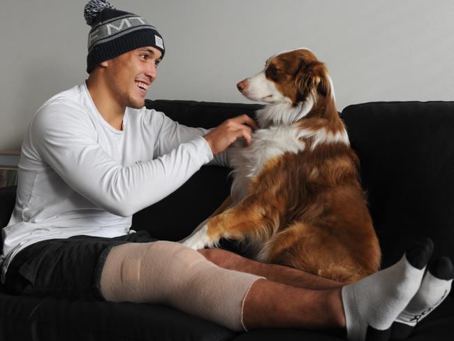 Woodward spent time recovering from his fourth ACL injury with dog Koda. Picture: Andrew Henshaw