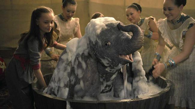 Nico Parker as Milly, left, and Dumbo in a scene from the movie Dumbo. Picture: Disney