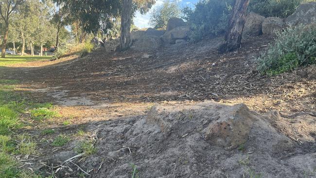 Boulders were placed inside ramps and across bike paths that had formed to prevent the boys riding their bikes at Point Cook’s Bayview Park. Picture: Nilsson Jones