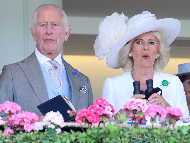 ASCOT, ENGLAND - JUNE 20: King Charles III and Queen Camilla react as they attend day three of Royal Ascot 2024 at Ascot Racecourse on June 20, 2024 in Ascot, England. (Photo by Chris Jackson/Getty Images)