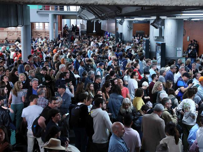 Passengers wait for their trains at Atocha station in Madrid on April 29, 2025, the day after a massive power cut affecting the entire Iberian peninsula and the south of France. Electricity was restored to almost all of Spain and Portugal on April 29 morning, allowing a gradual return to normal life in the two countries, which were hit on April 28 by a giant blackout that lasted up to ten or even twenty hours depending on the region. The return of power has enabled rail traffic to be restored on several major routes, including Madrid-Seville and Madrid-Barcelona, according to the national company Renfe. However, traffic remains suspended on several other major routes, as the authorities have given priority to restoring suburban trains. (Photo by Thomas COEX / AFP)