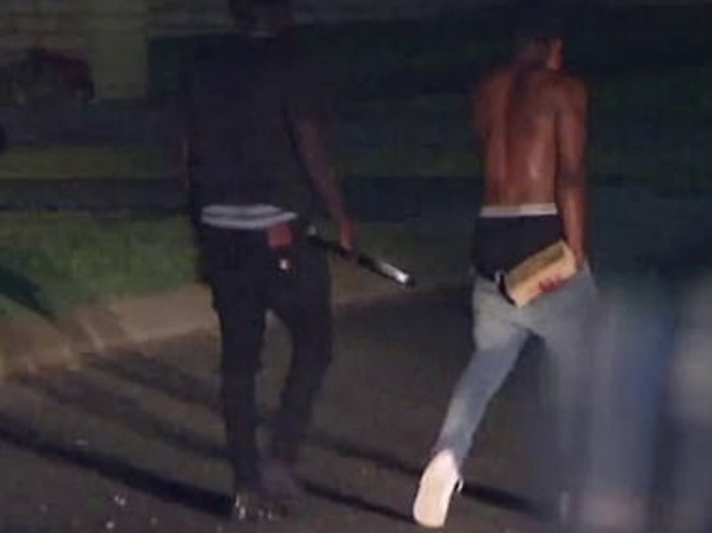 Youths were wielding metal poles and bricks. Picture: Seven News