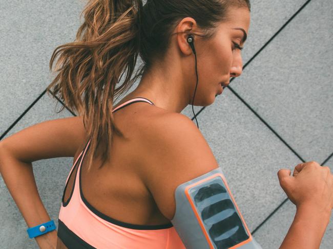 Beautiful young woman exercising outdoor.