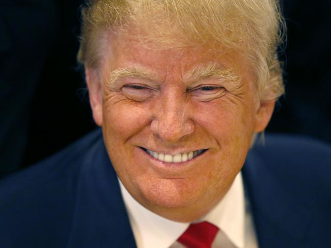 FILE - In this June 29, 2015, file photo, Republican presidential candidate Donald Trump smiles for a photographer before he addresses members of the City Club of Chicago, in Chicago. As other presidential candidates fight to raise money, Trump is reminding everyone he’s already got a lot of it. The celebrity businessman’s campaign was expected to reveal details on July 15 of his fortune, which he estimated last month at nearly $9 million when announcing his Republican presidential candidacy. (AP Photo/Charles Rex Arbogast, File)