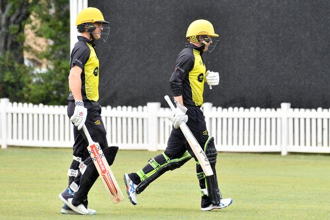 Wests batsman Isaiah Snell and Sam Truloff come off the ground for rain. Toombul v Wests in first grade Queensland Premier Cricket Saturday September 28, 2024. Picture, John Gass