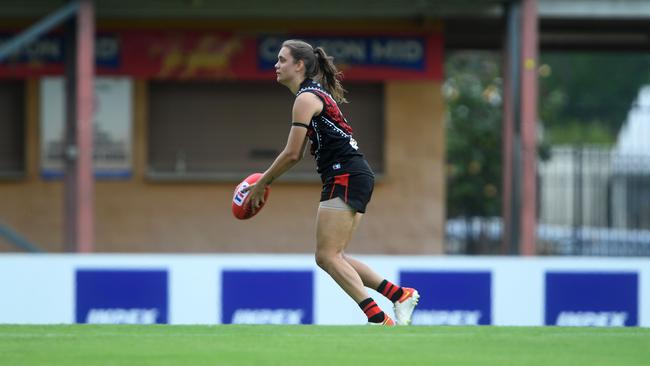 Kirra Hill-Carter runs the ball through the middle in round one of the NTFL 22/23 season. Picture: (A)manda Parkinson