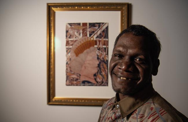 Telstra Emerging winner Titus Nganjmirra with artwork Queen Elizabeth. Picture: Keri Megelus