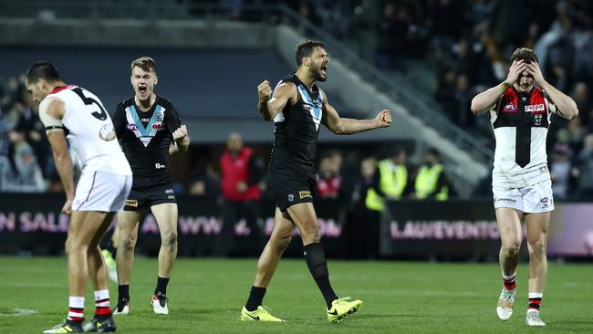 Port Adelaide’s Robbie Gray and Paddy Ryder celebrate their last gasp that secured round 19 victory against St Kilda at Adelaide Oval. Picture Sarah Reed.