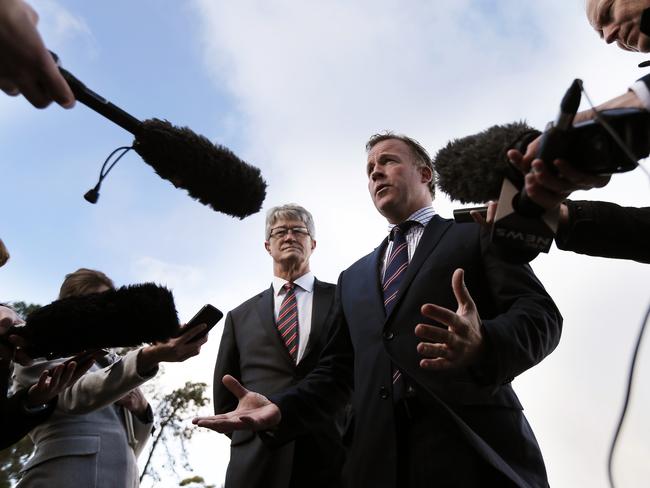 Premier Will Hodgman (centre) and AFL Chairman Mike Fitzpatrick talk about the future of AFL football in Tasmania