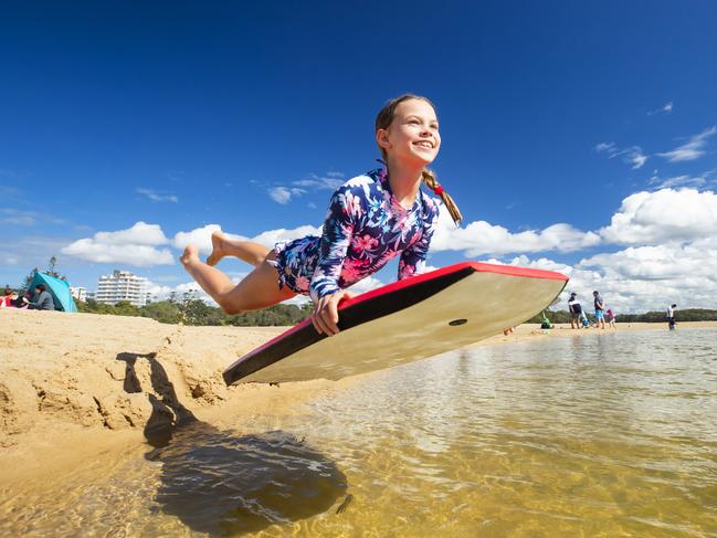 HOLD SEE COURIER MAIL PIC DESK!10 year old Amelia Parker from Brisbane flys on her board at Currimundil Lake. Photo Lachie Millard