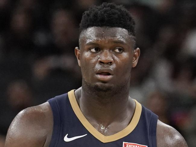 New Orleans Pelicans' Zion Williamson walks upcourt during the second half of an NBA preseason basketball game against the San Antonio Spurs, Sunday, Oct. 13, 2019, in San Antonio. (AP Photo/Darren Abate)