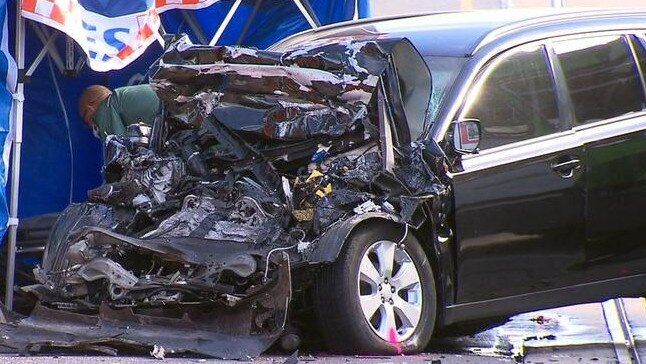 The front of the black wagon was entirely crumpled following the head-on collision that killed the driver. Picture: 9 News