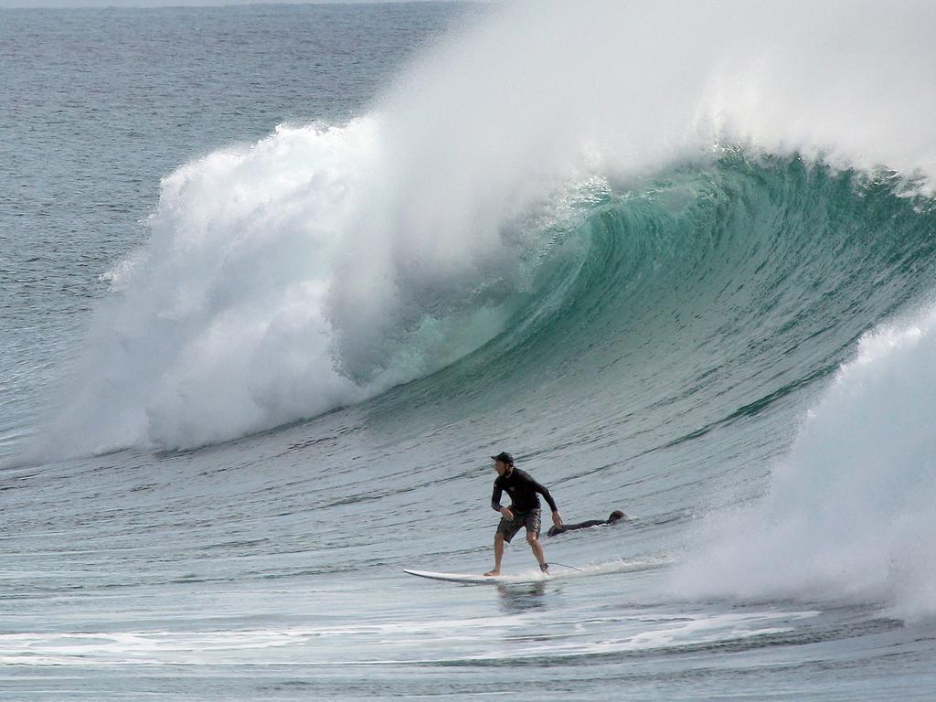 Surfers pictured enjoying good swell and near perfect waves at Snapper Rocks. Picture: Mike Batterham