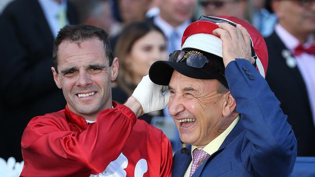 Noel Callow has some fun with forman Joe Agresta after riding Thrillster to victory in race 3, The Avenel Equine Hospital 2YO Vobis Sires, during Caulfield Owners and Breeders Race Day at Caulfield Racecourse in Melbourne, Saturday, April 21, 2018. (AAP Image/George Salpigtidis) NO ARCHIVING, EDITORIAL USE ONLY