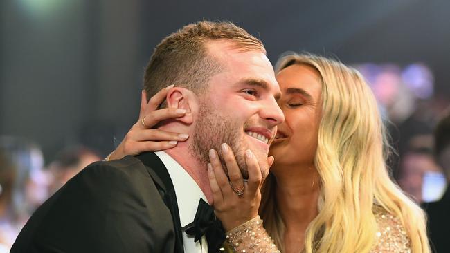 MELBOURNE, AUSTRALIA - SEPTEMBER 24:  Tom Mitchell of the Hawks gets a kiss from girlfriend Hannah Davis after being announced the 2018 Brownlow Medalist at Crown Entertainment Complex on September 24, 2018 in Melbourne, Australia.  (Photo by Quinn Rooney/Getty Images)