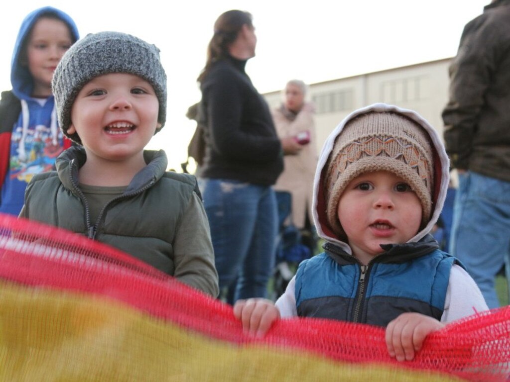 William and Cooper Martin enjoy watching the fires at the Killarney Bonfire Night on Saturday, July 24, 2016